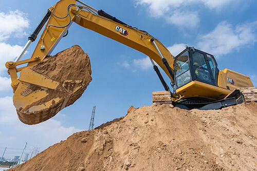 Cat excavator in the field