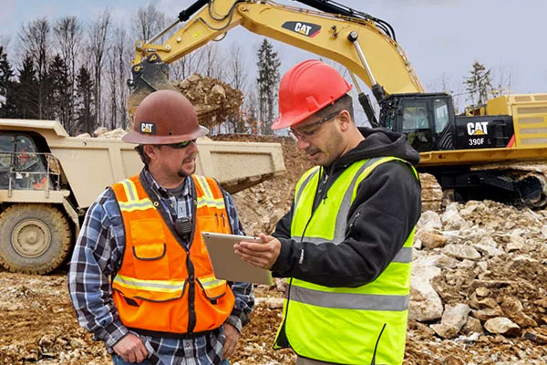 Caterpillar employees using Cat equipment